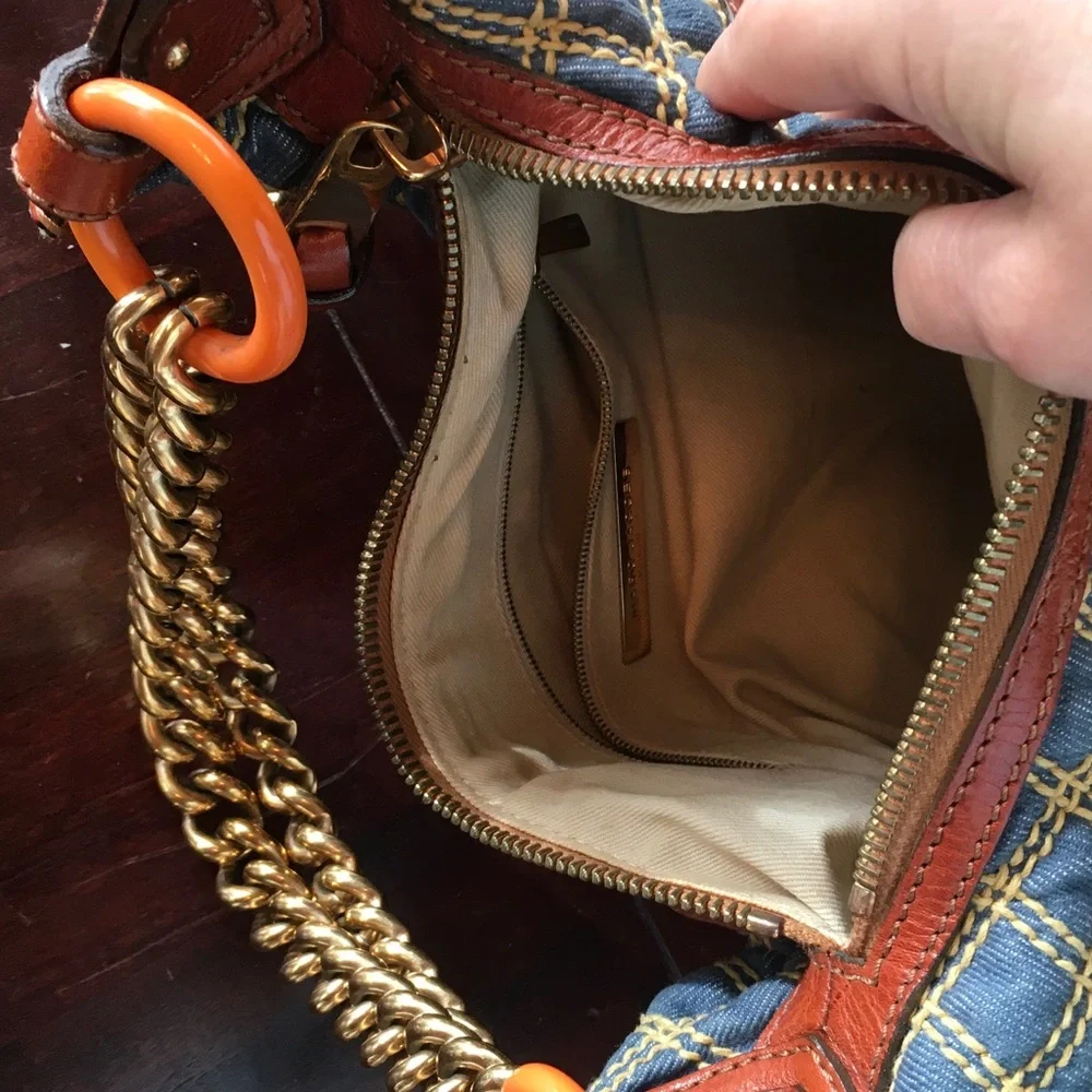 Blue Quilted Hobo Bag with Brown Trim and Gold Chain Handle